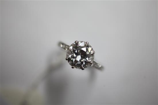 A 1940s/1950s platinum and single stone diamond ring with diamond set shoulders, size L.